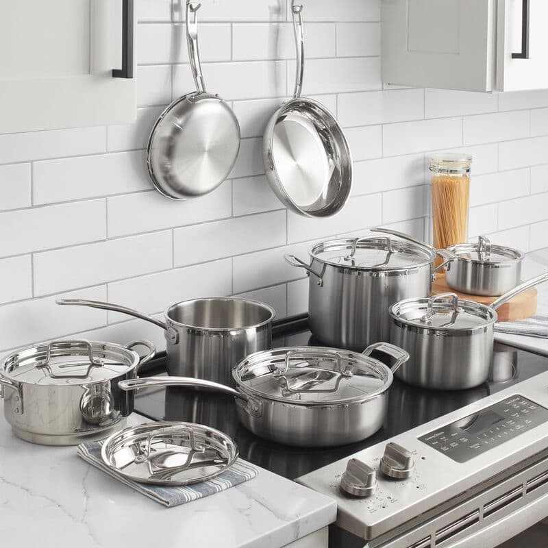 Cuisinart stainless cookware set displayed on a cooktop