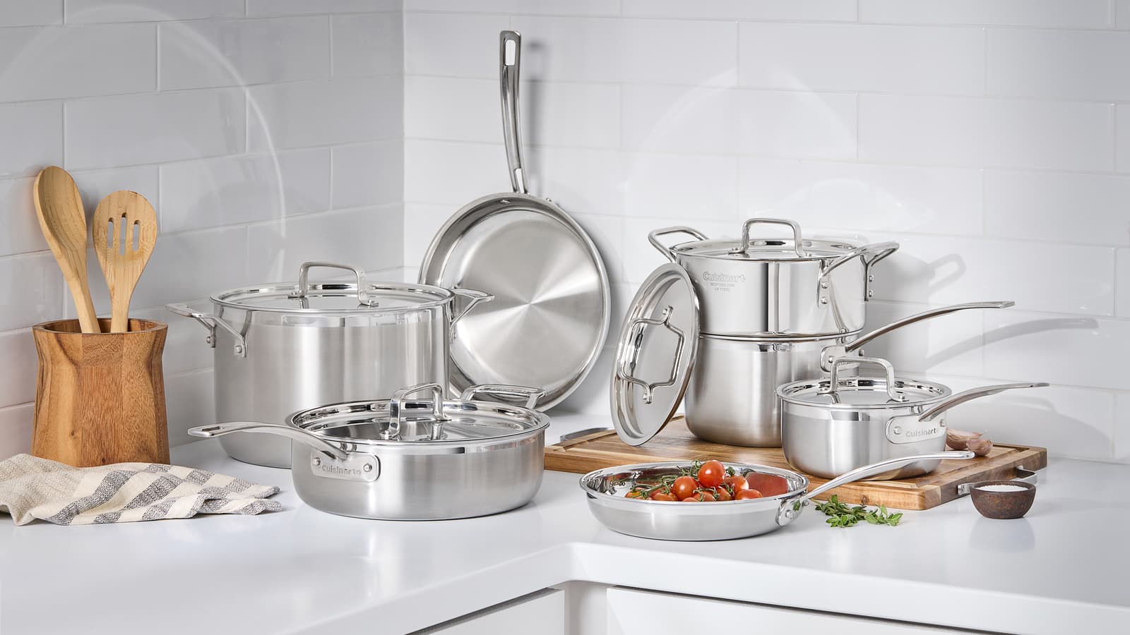 Cuisinart MultiClad stainless cookware arranged in a bright kitchen